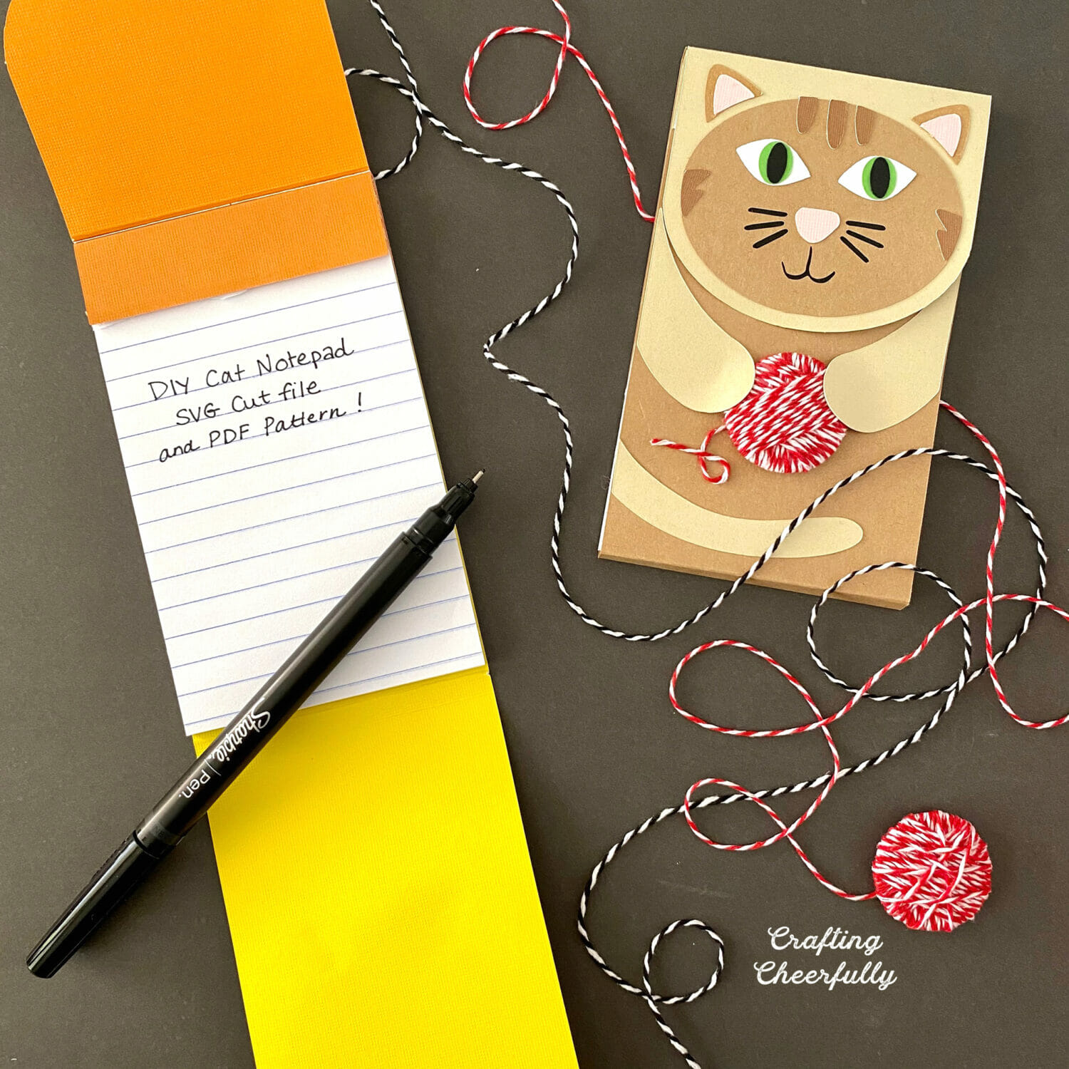 Paper cat notepads; one is open with the words DIY Cat Notepad SVG cut files and PDF Pattern