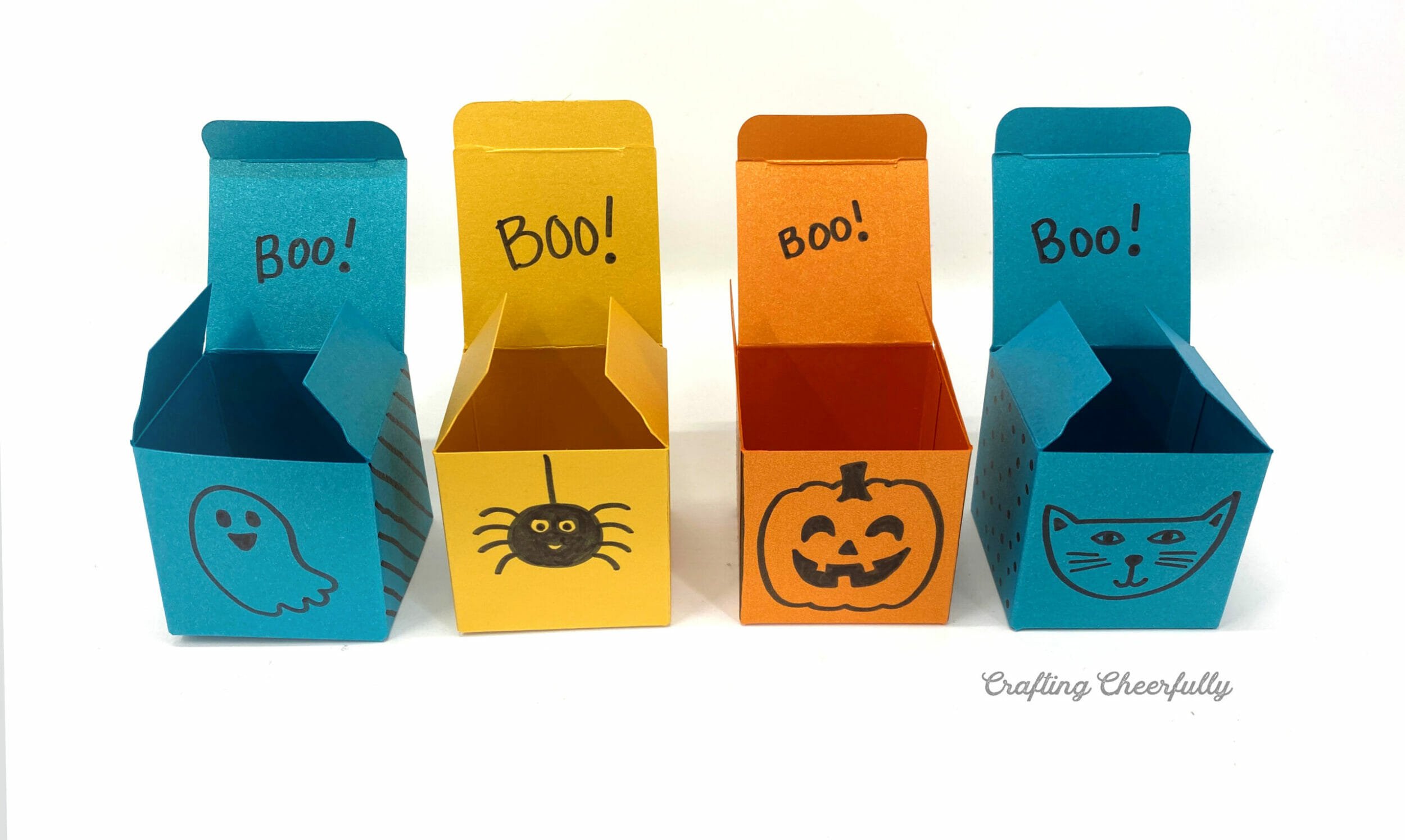 The boxes are in a row all with their lids up to reveal the word boo.