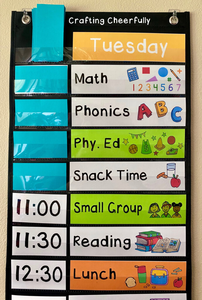 A visual schedule chart with time and subject cards.