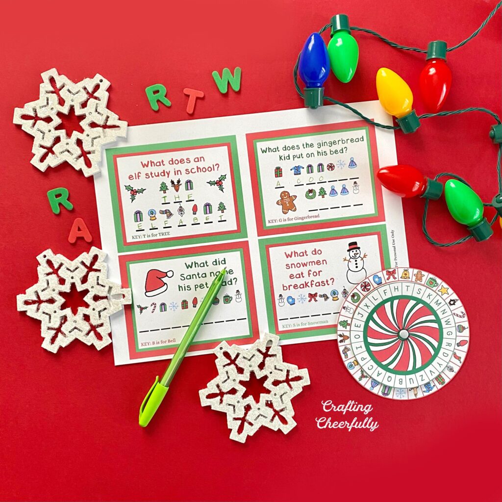 Christmas decoder wheel printables on a red background with snowflakes and holiday lights.