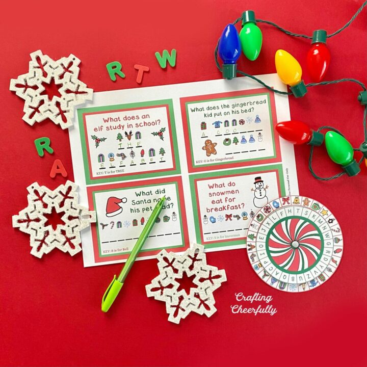 Christmas decoder wheel printables on a red background with snowflakes and holiday lights.