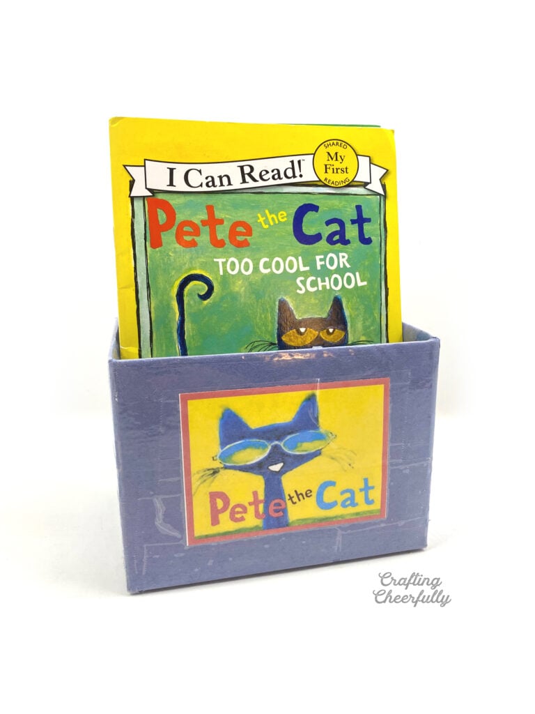 Blue book bin filled with "Pete the Cat" books. 