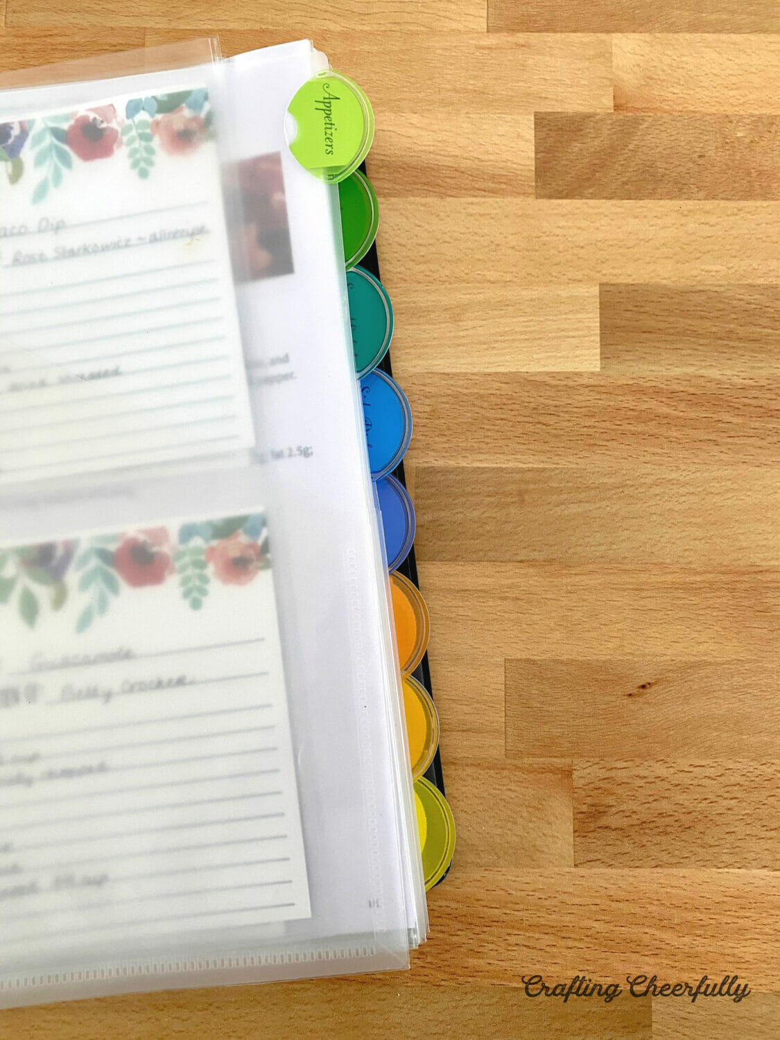 Close up of tabs in a cookbook binder.