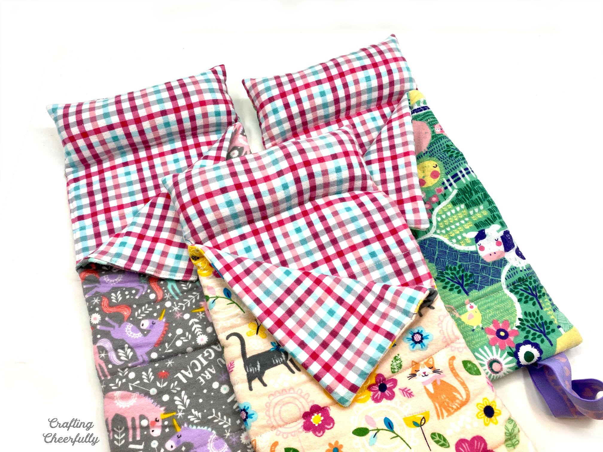 Three flannel sleeping bags for dolls.