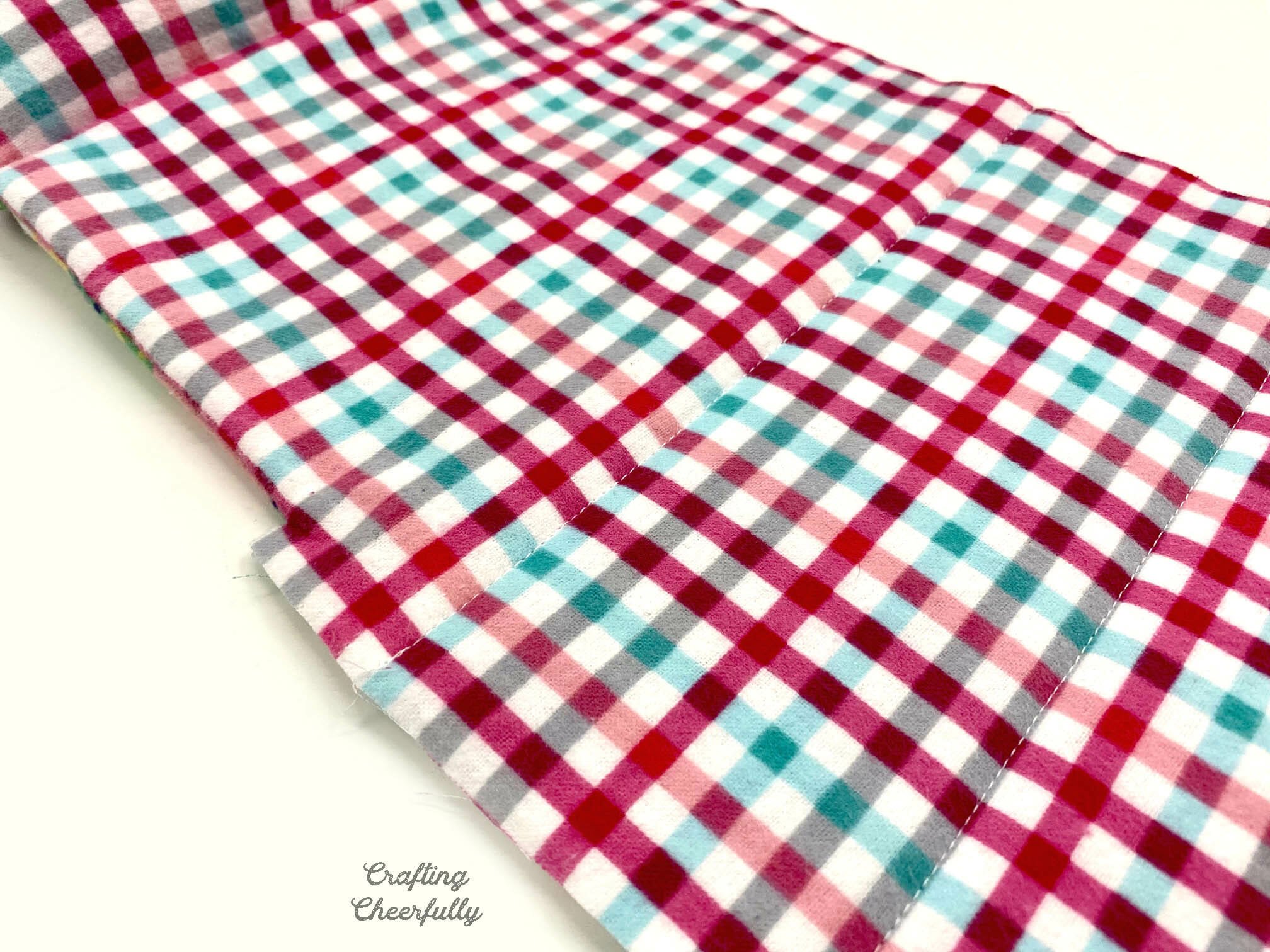 Bottom of sleeping bag is stitched horizontally quilting it every 3" or so.
