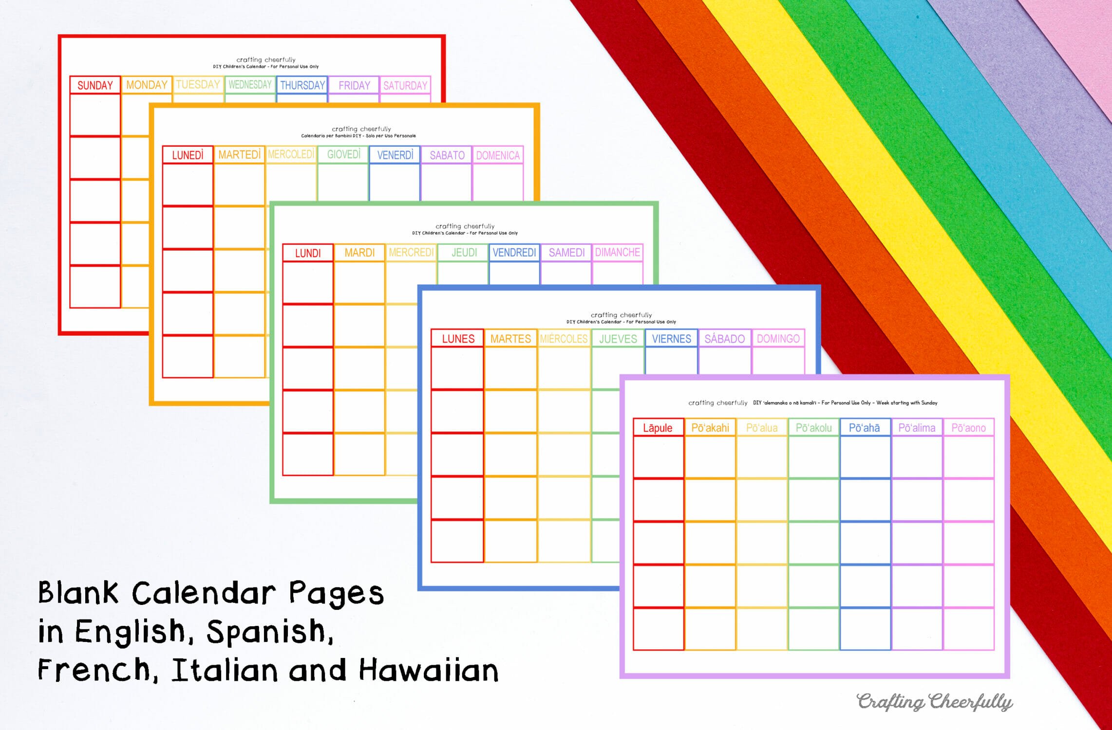 Blank calendar pages in English, Spanish, French, Italian and Hawaiian lay on a white table with colorful paper.