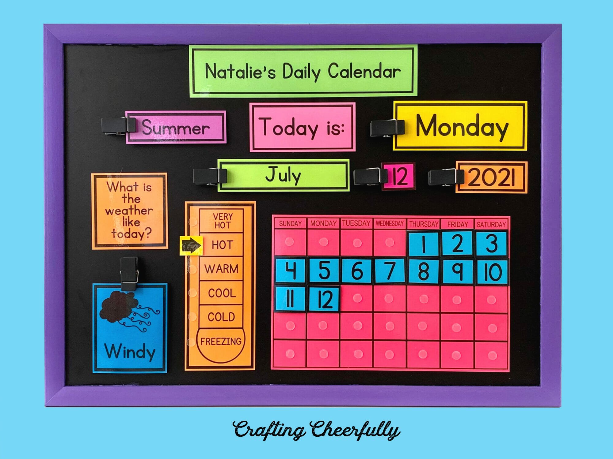 Chalkboard calendar with colorful bold printables on a blue background.