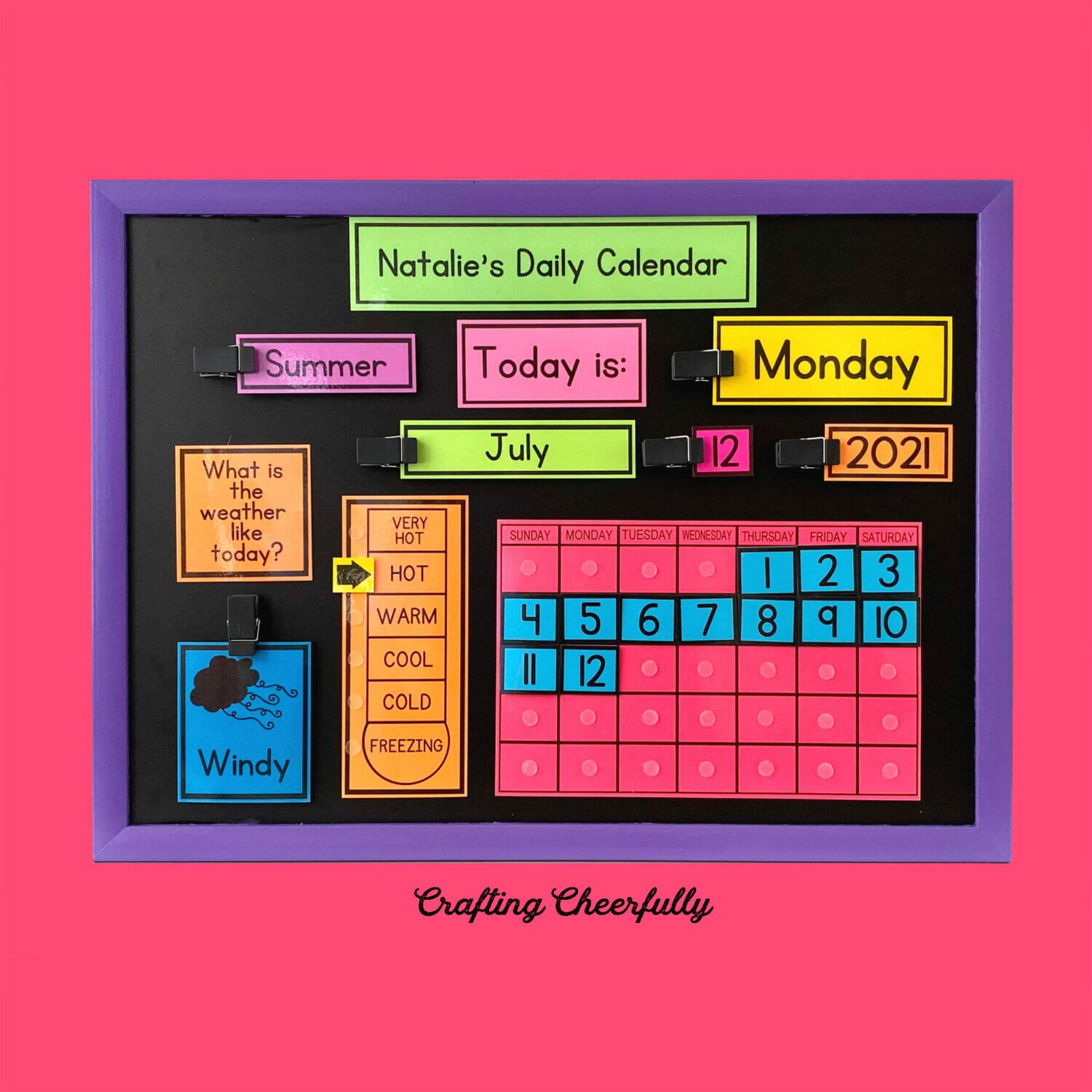 Chalkboard calendar with colorful bold printables on a blue background.
