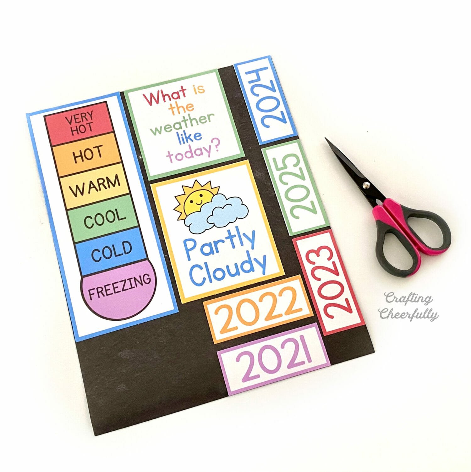Calendar printables on a magnet sheet with a small scissors.