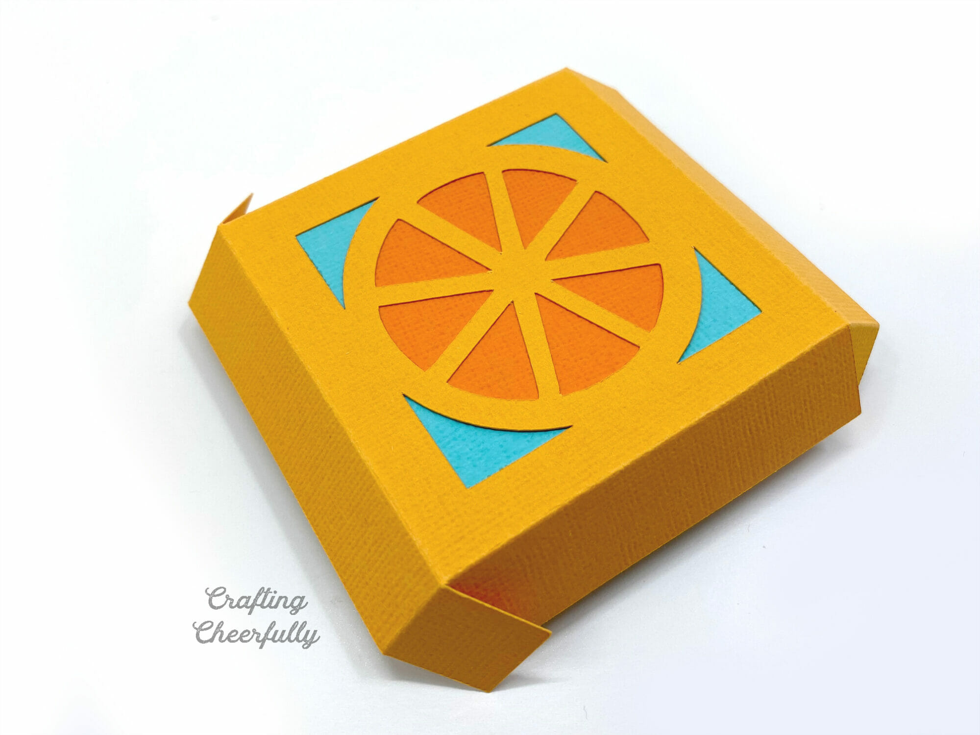 The lid for a Orange tutti frutti party favor box.