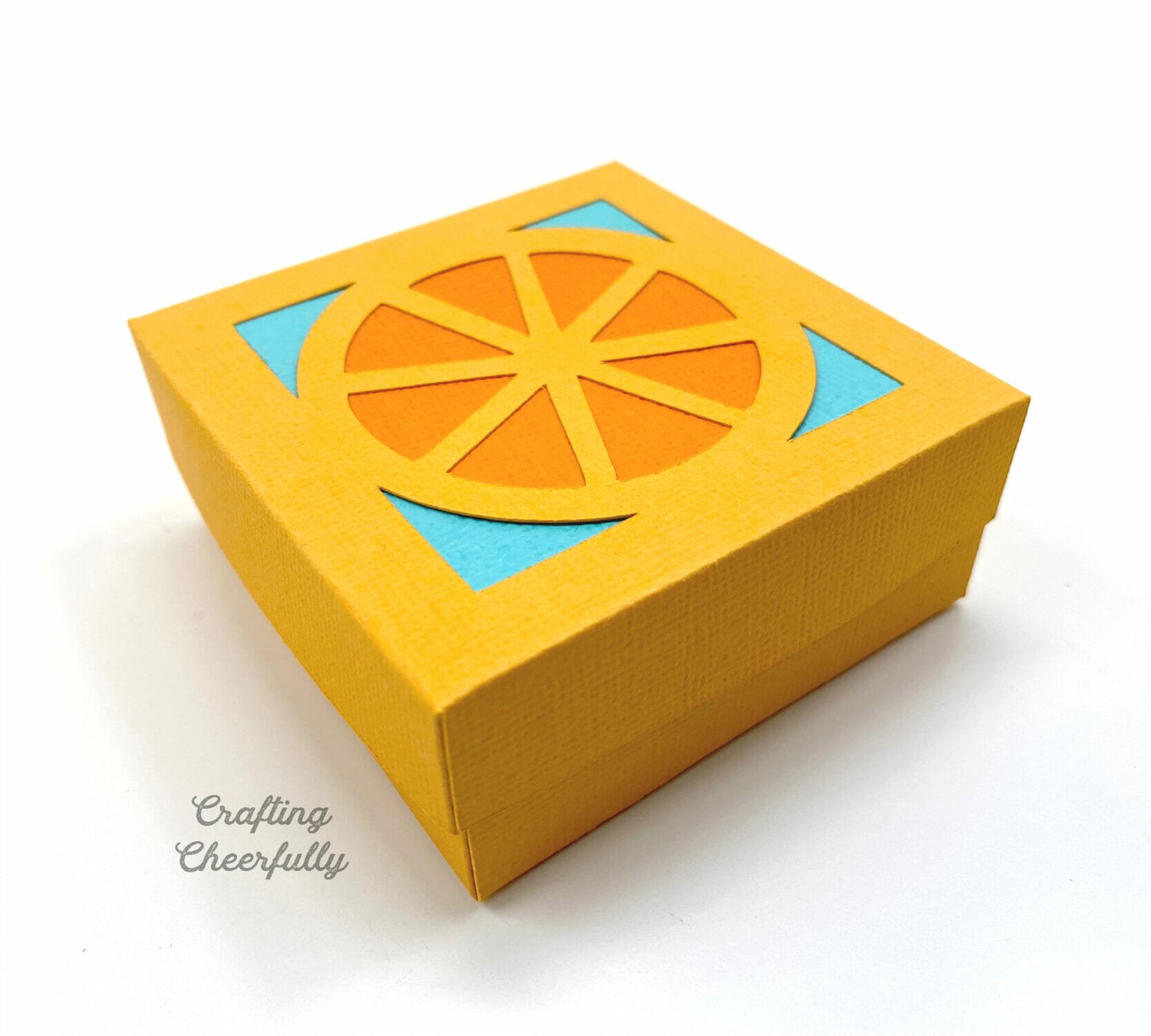 Orange tutti frutti party favor box.