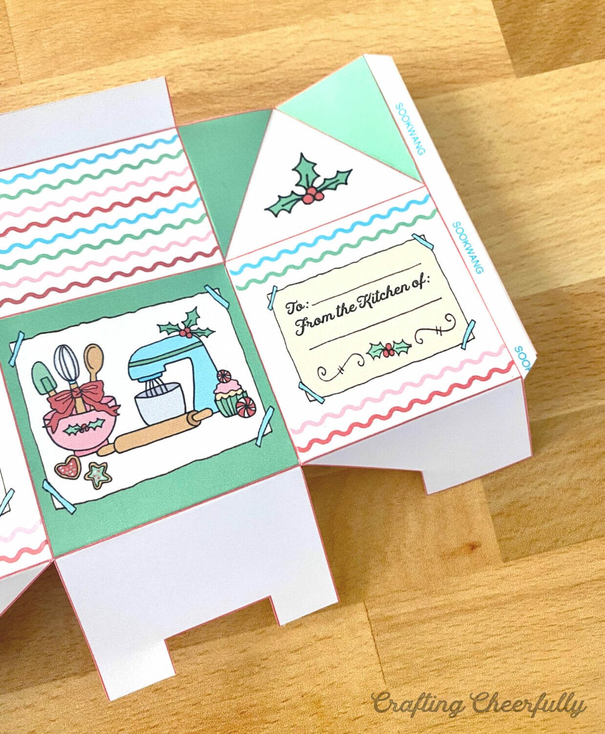 A paper treat wth double-sided tape on to the tabs.