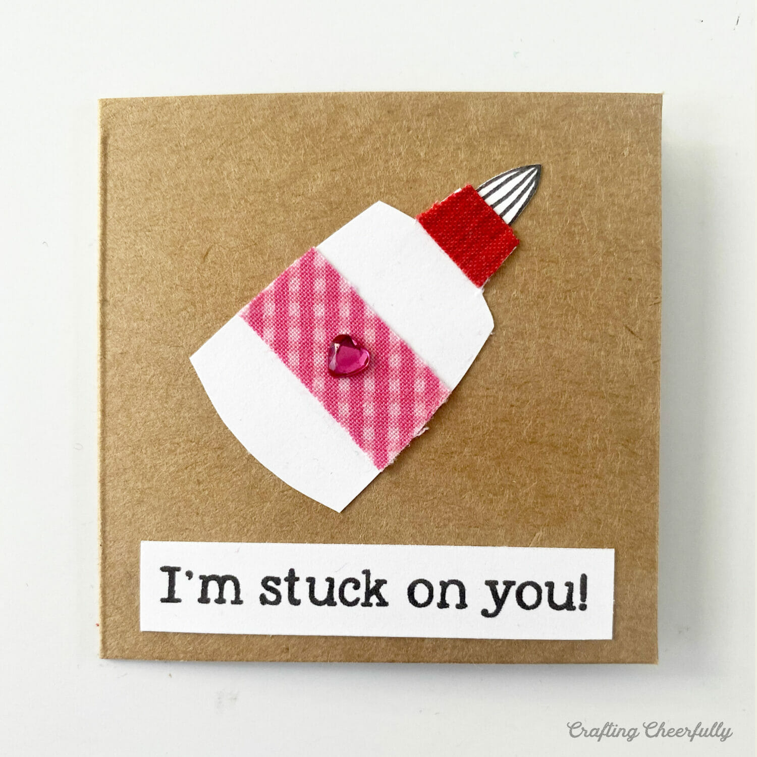 Valentine with a paper glue bottle on it; the valentine reads I'm stuck on you.