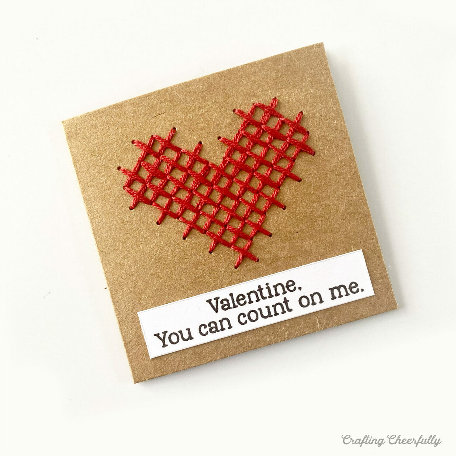 Valentine with a red cross-stitched heart that reads Valentine, You can count on me.