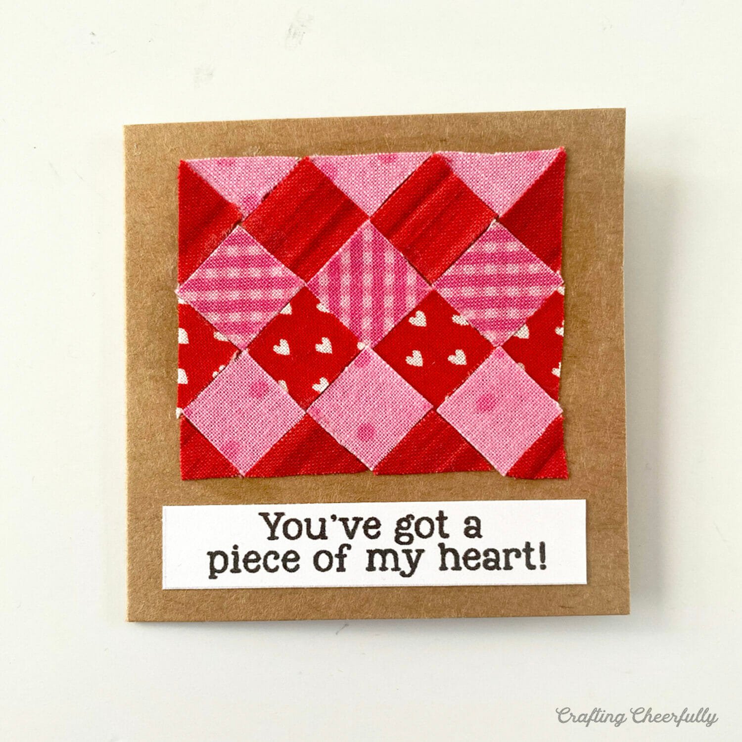 Valentine with a tiny fabric quilt on it that reads You've got a piece of my heart.