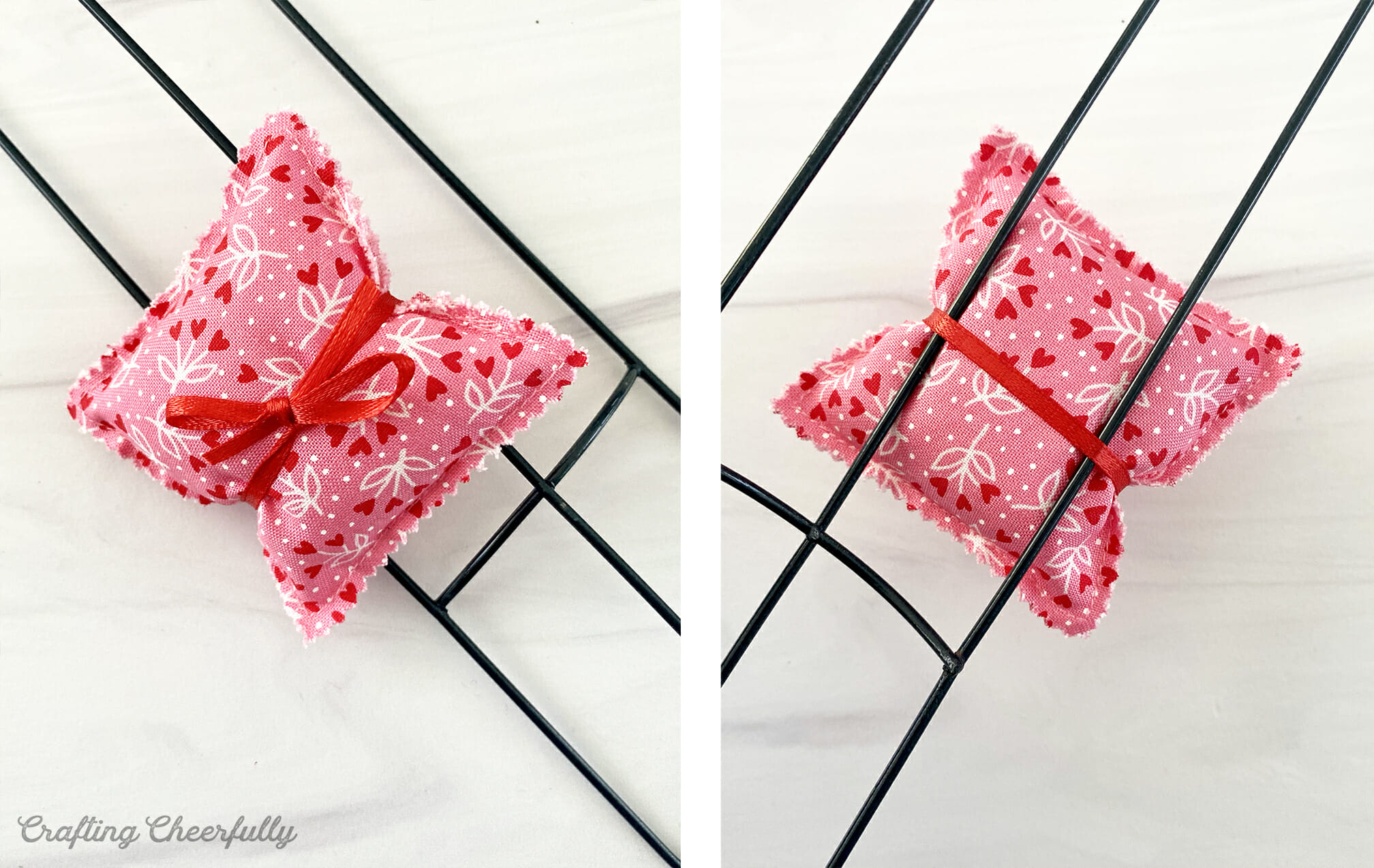 One pillow is tied to a heart wreath form using ribbon.