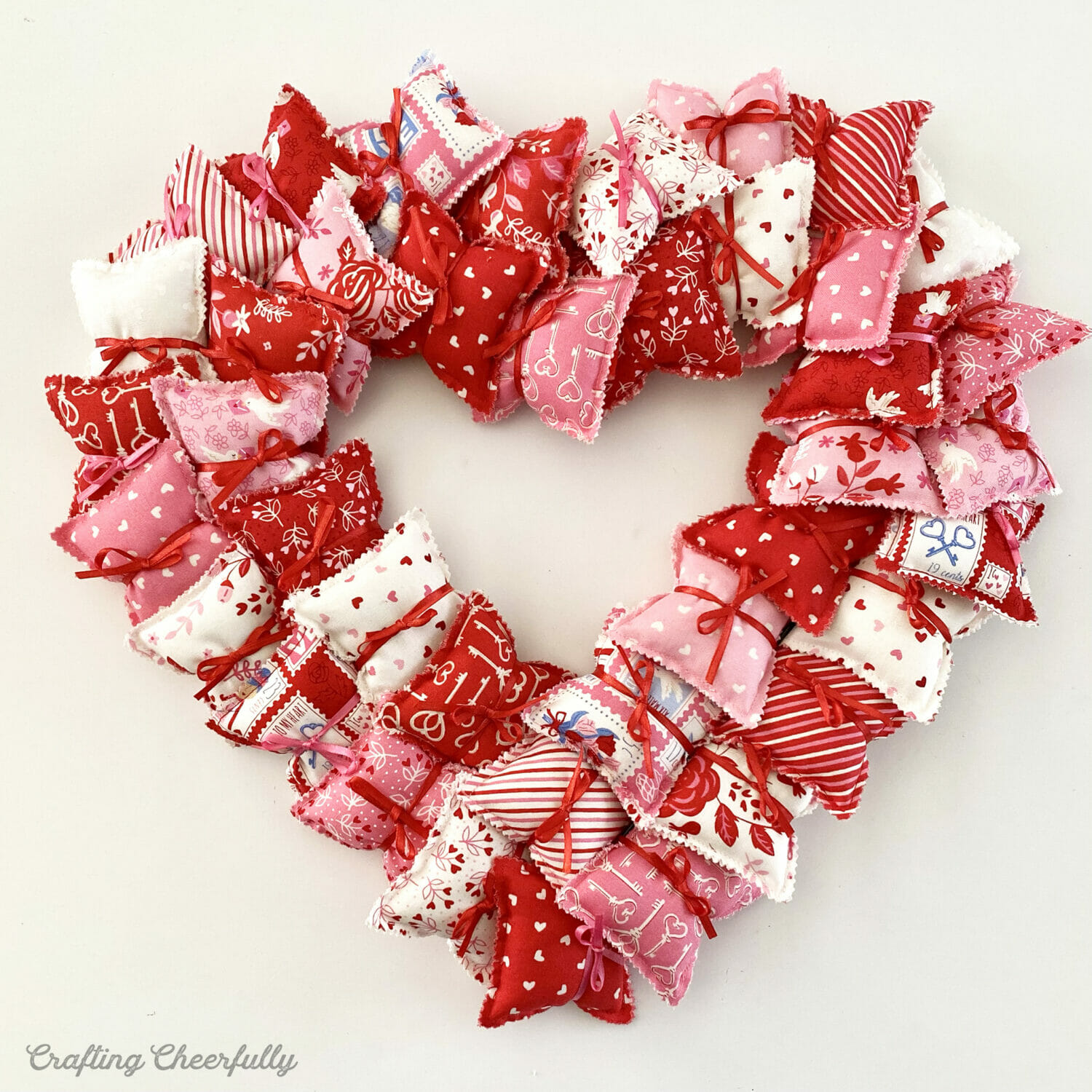 Heart-shaped Valentine's Day pillow wreath.