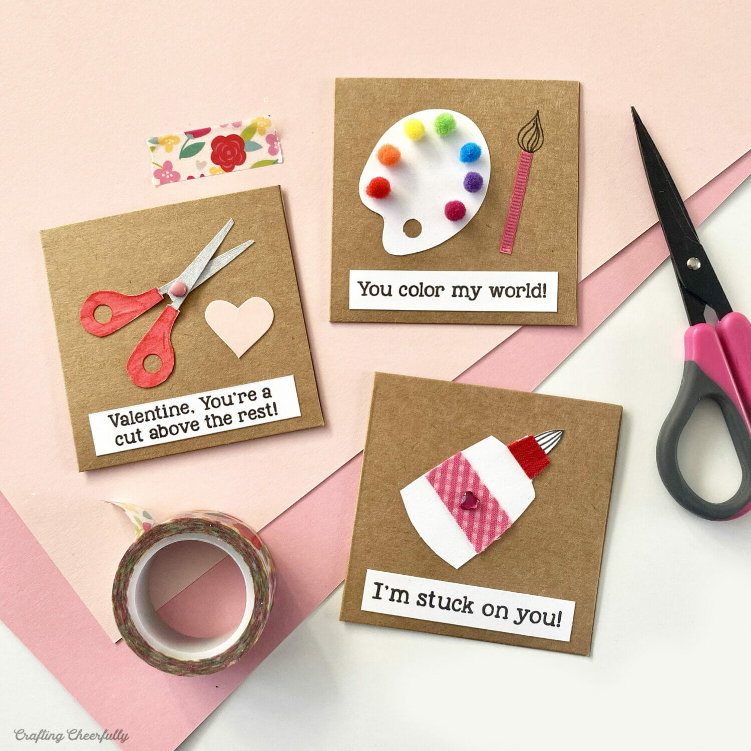 Craft-themed valentines with crafty puns lay on a table surrounded by craft supplies.
