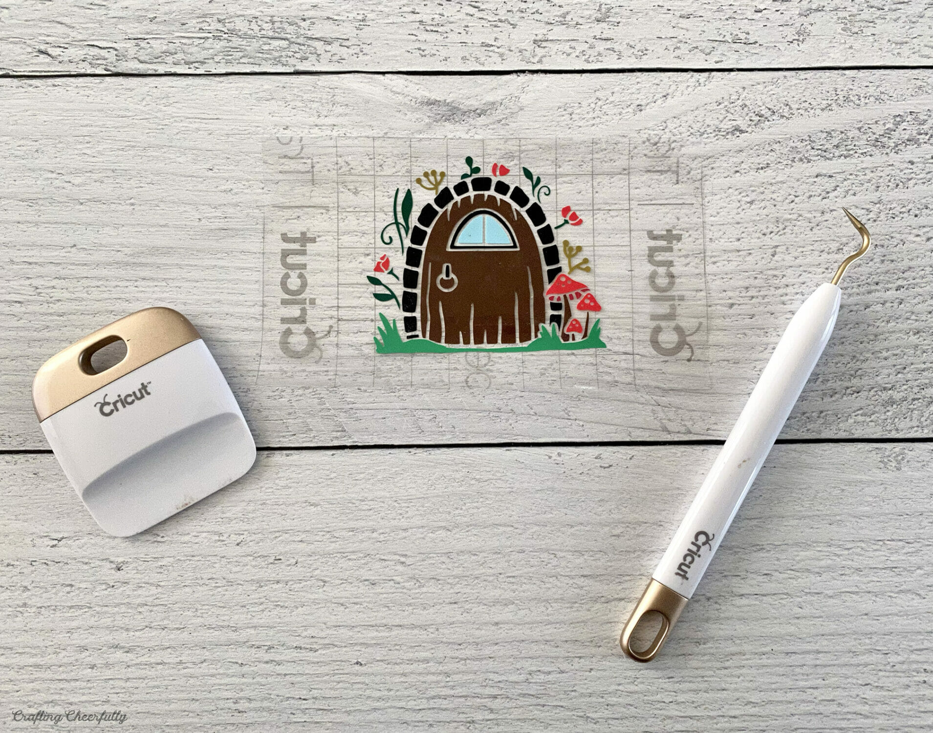 A vinyl fairy door attached to transfer tape.