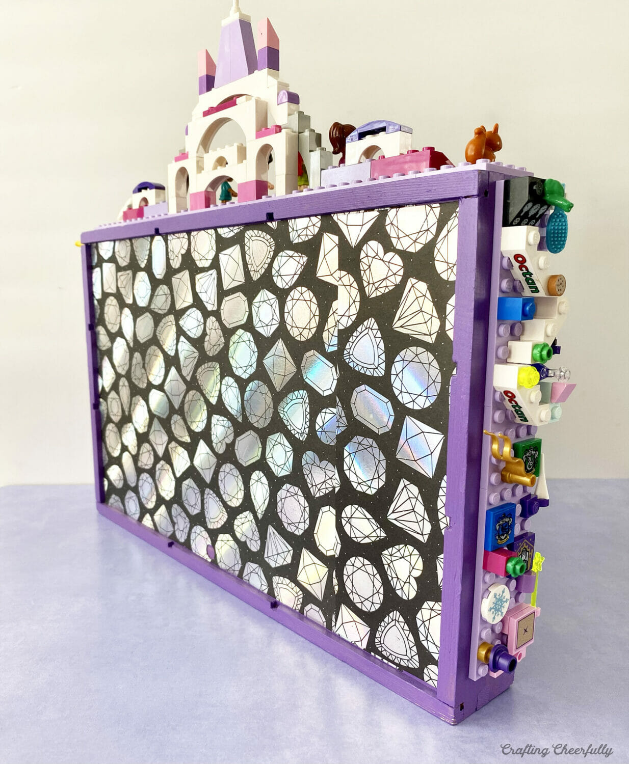 Back of display case covered in scrapbook paper.