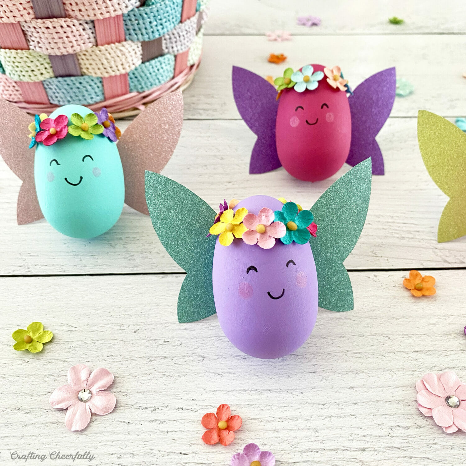 Fairy Easter eggs with sparkly wings and flower garlands.