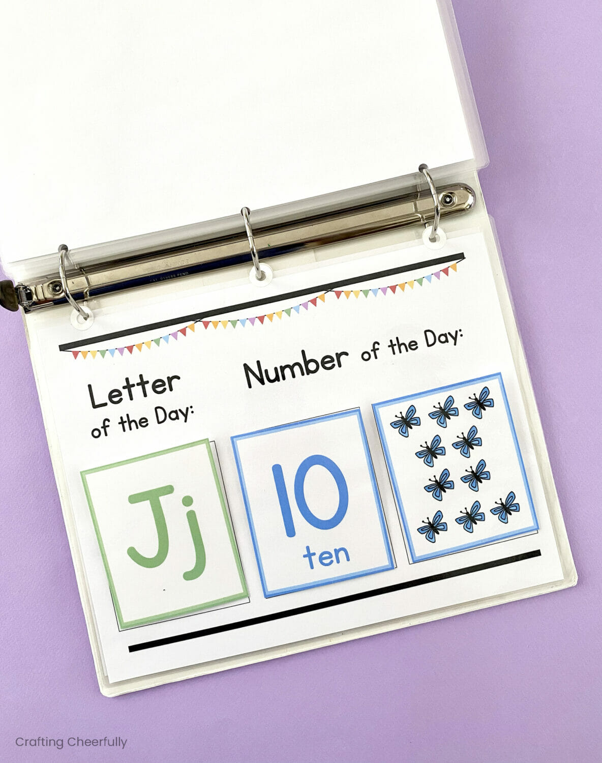 Busy book open showing letter and number flashcards.