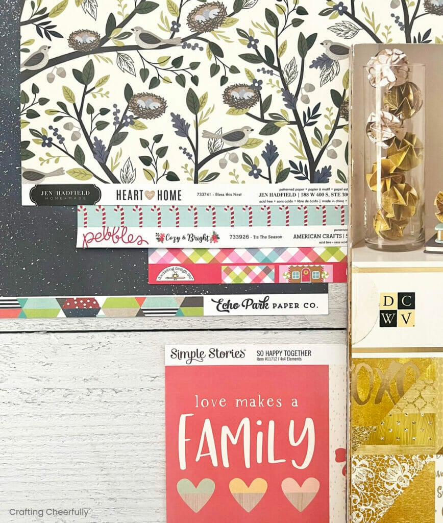 Assortment of patterned paper sheets showing the brand label of each paper.