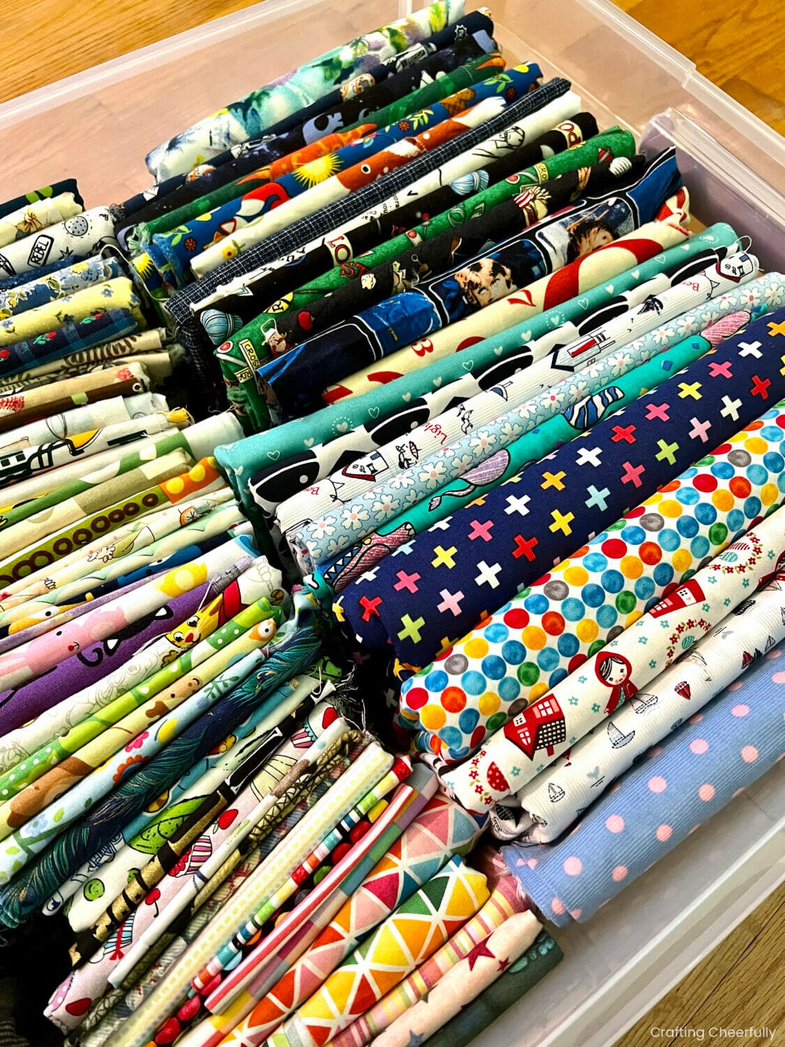 Printed cotton fabric organized in an under the bed storage bin.