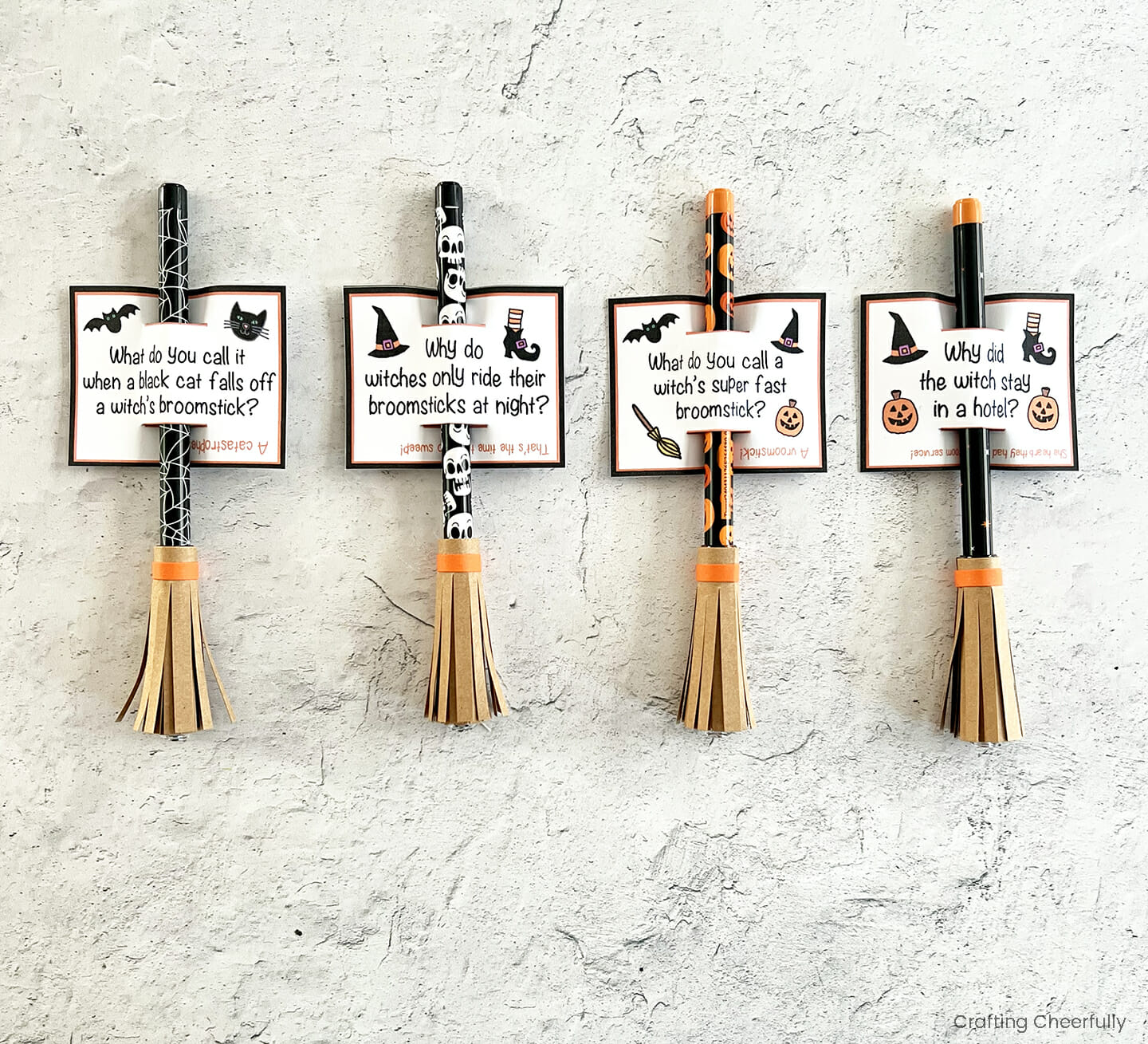 Pencils decorated like witch's broomsticks with printable pencil tags on them.