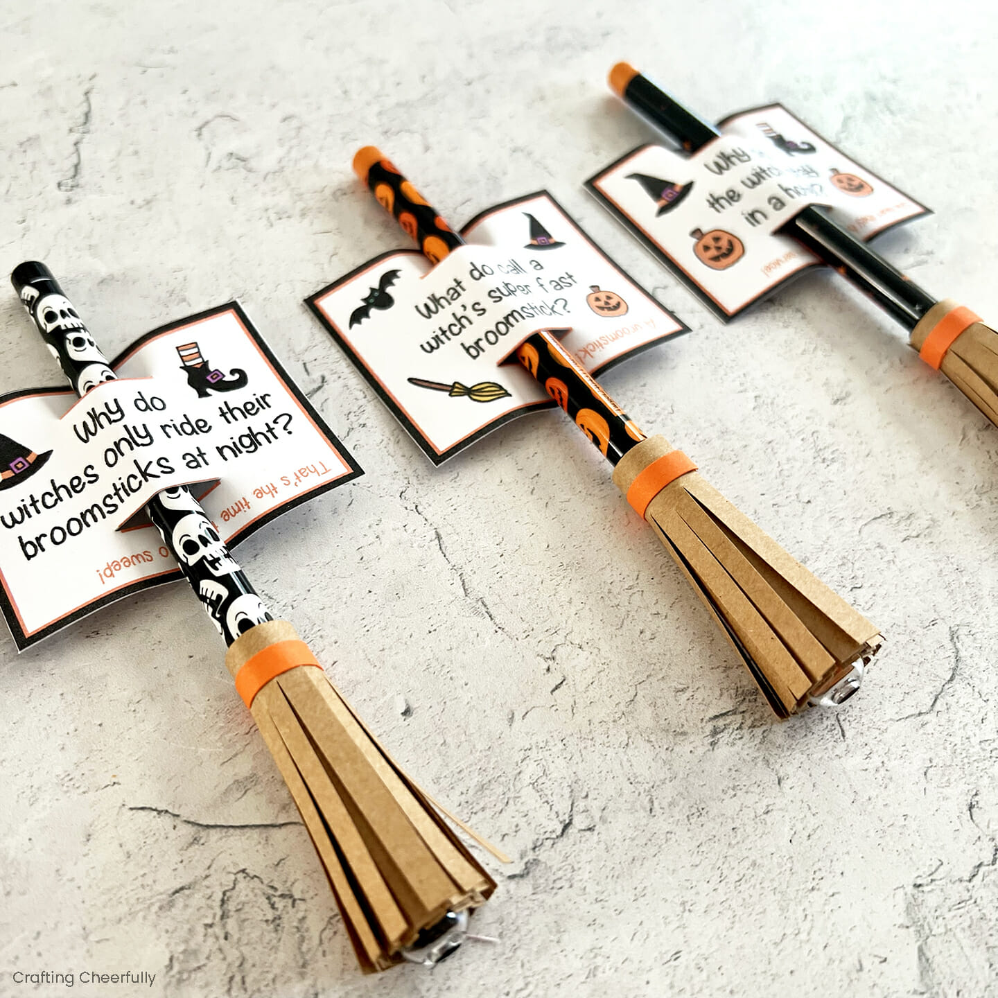 Pencils decorated like witch's broomsticks with printable pencil tags on them.