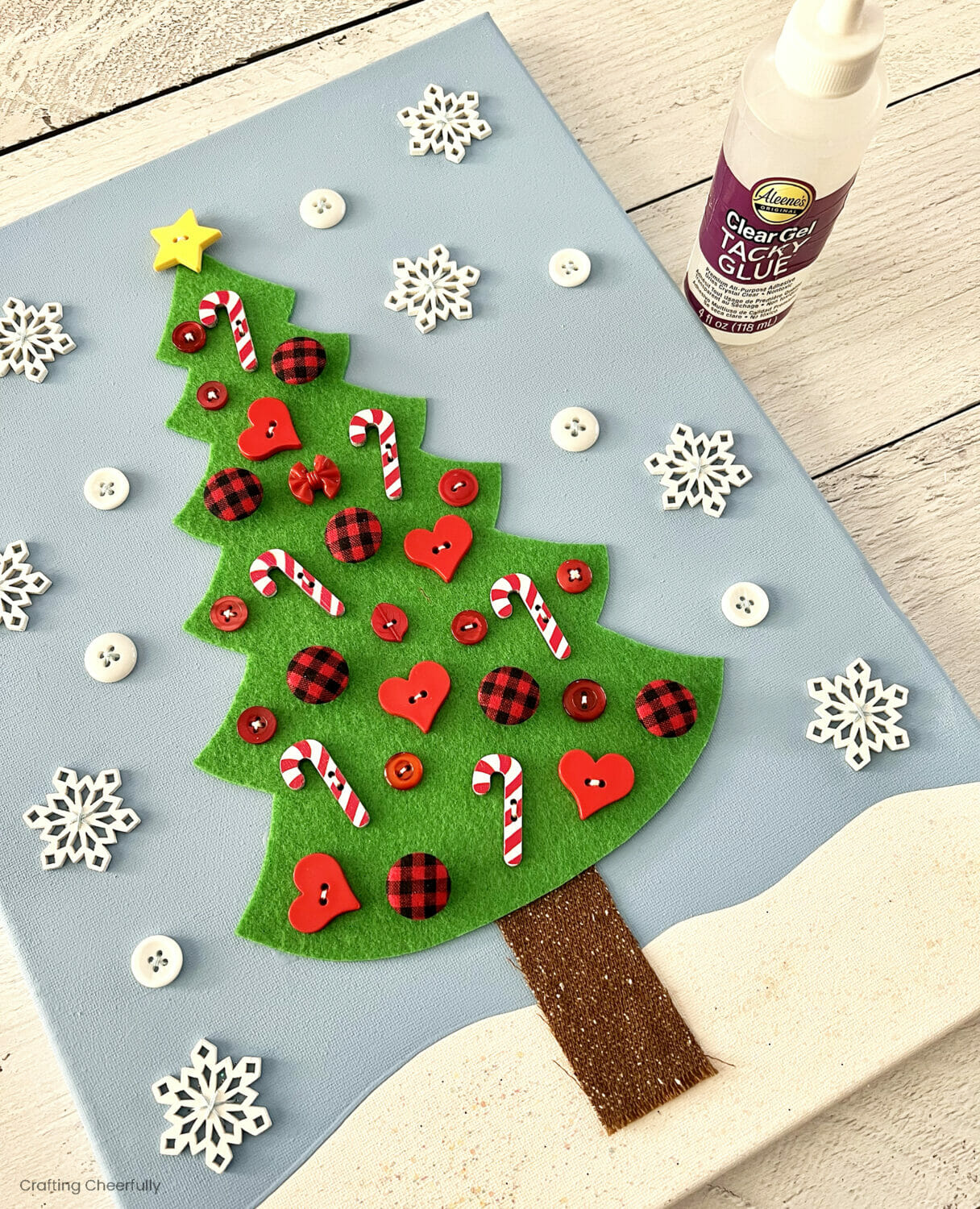 The Christmas tree is glued to the center of the canvas.
