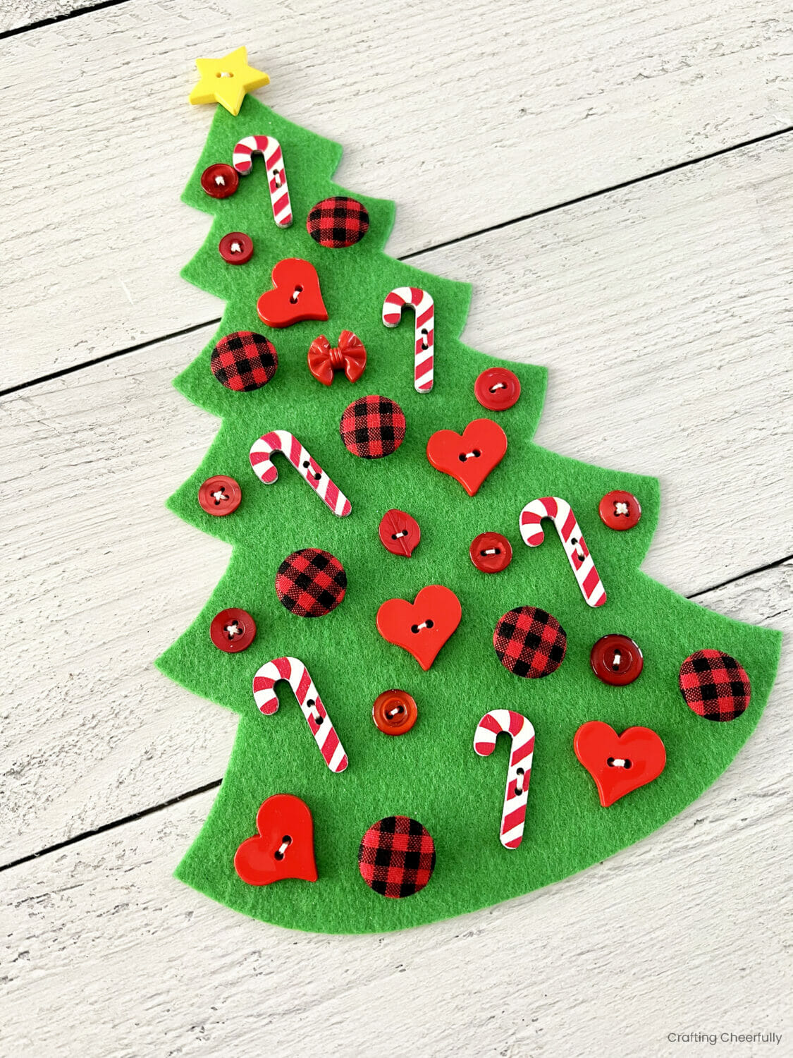 Buttons are stitched to the felt tree.