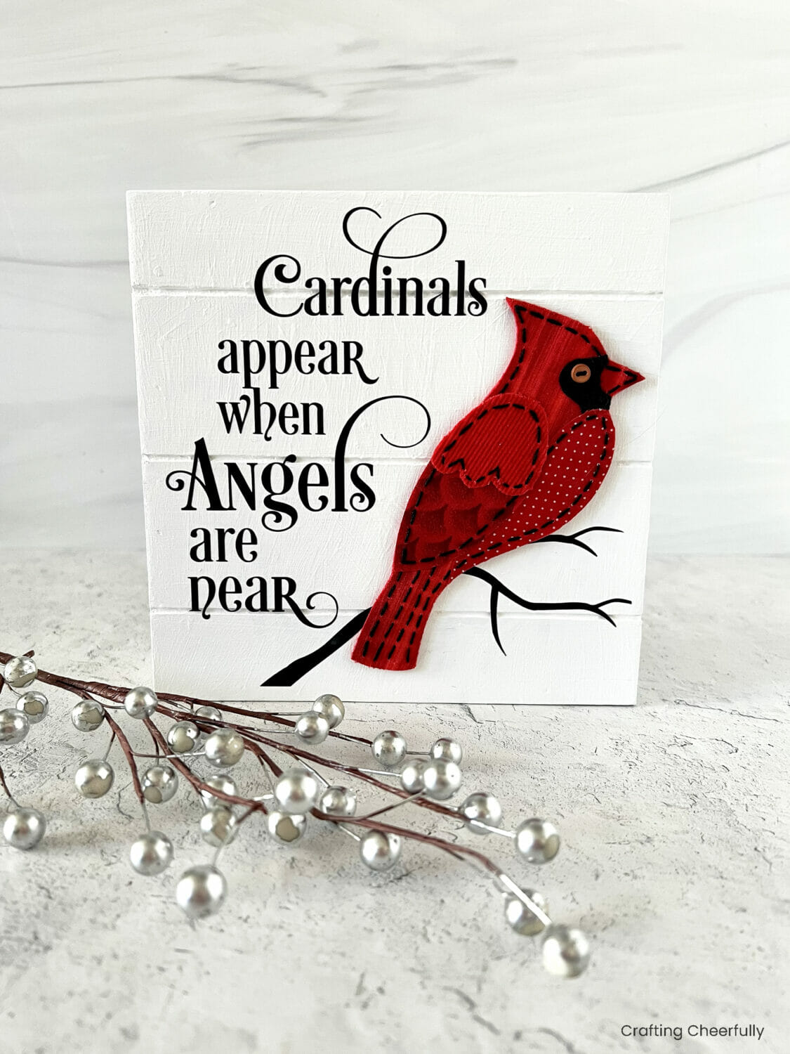 White wooden sign with red cardinal, vinyl design reads Cardinals appear when angels are near.