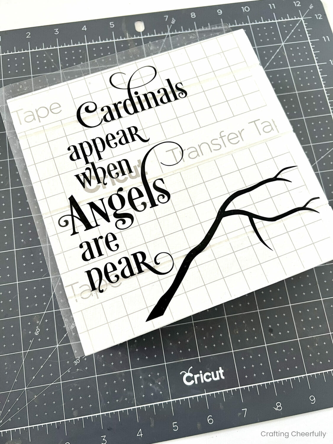 Vinyl design is applied to the top of the square white wood sign with transfer tape.