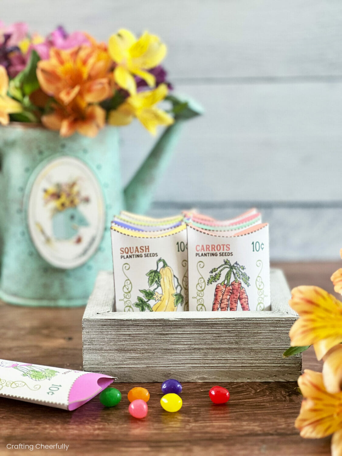 A wooden box filled with paper seed boxes designed to look like vegetable seed boxes.