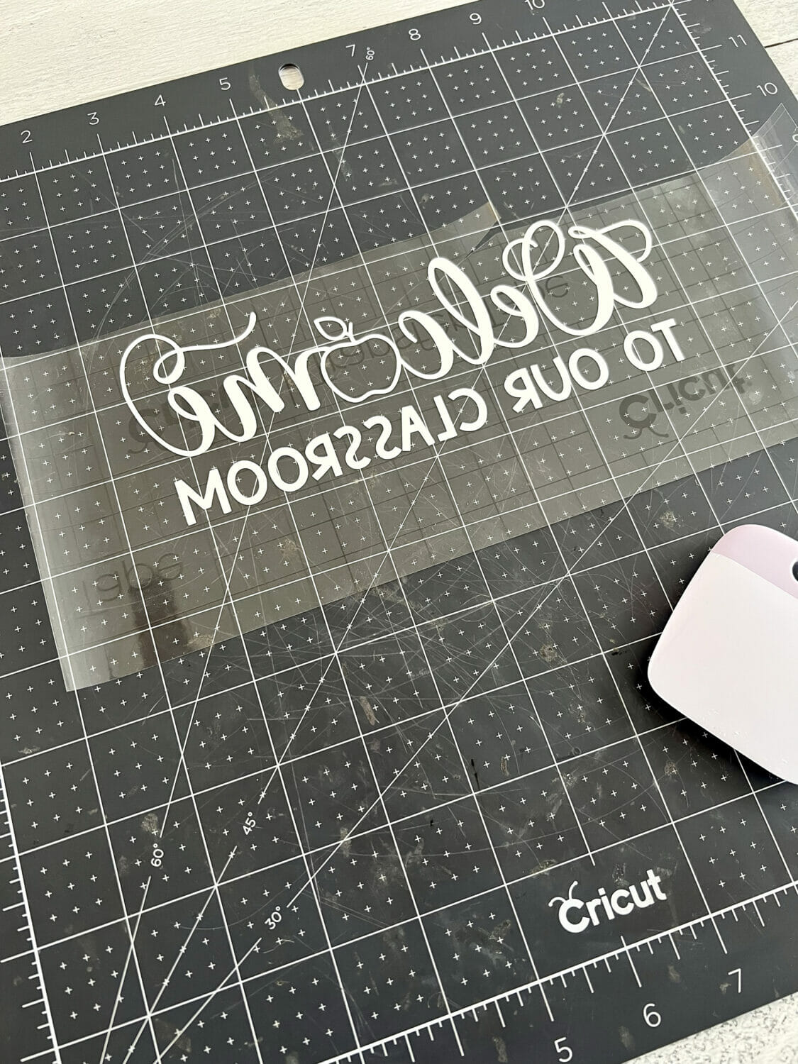 The vinyl image on transfer tape with the backing removed.
