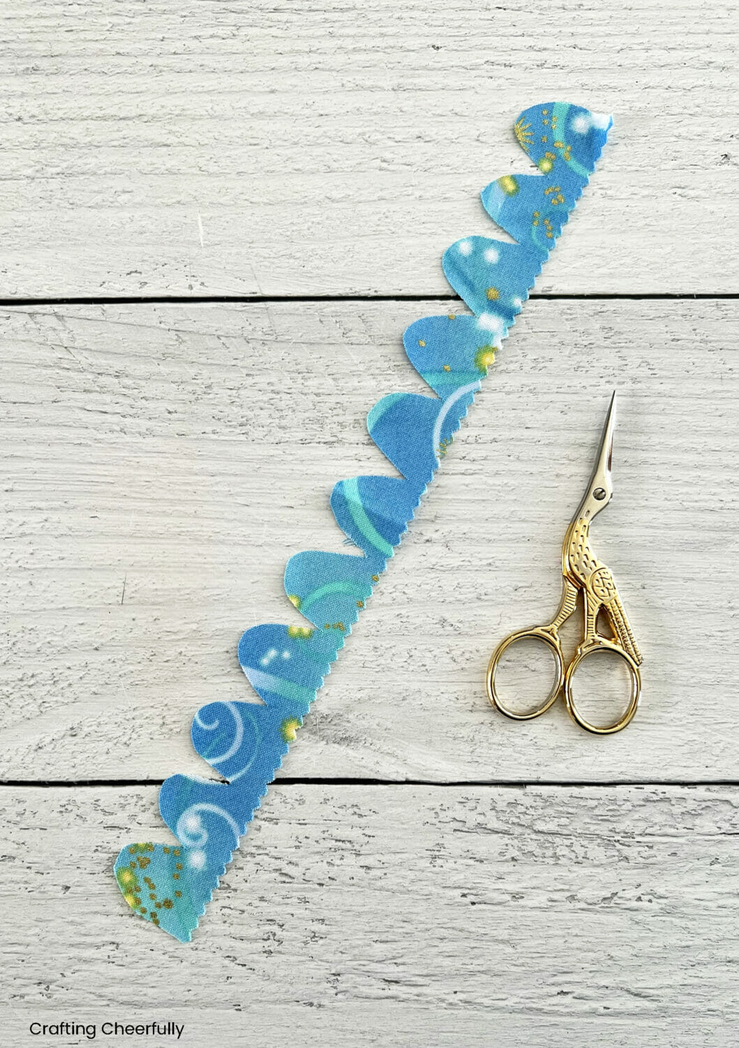 A long strip of fabric with a scalloped edge.