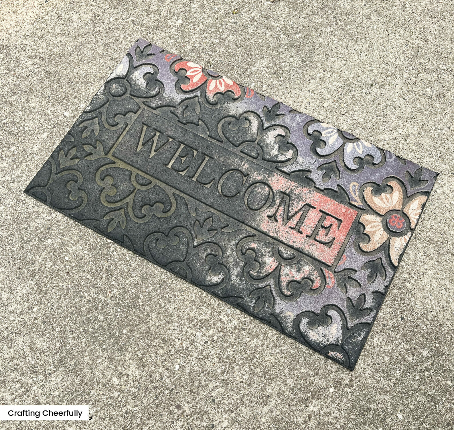 Welcome sign that is partially faded away.