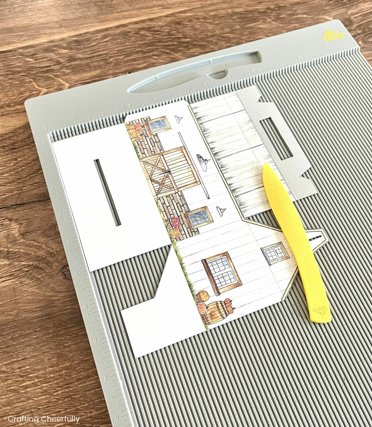 The treat box pieces are scored with a stylus on a scoring board.