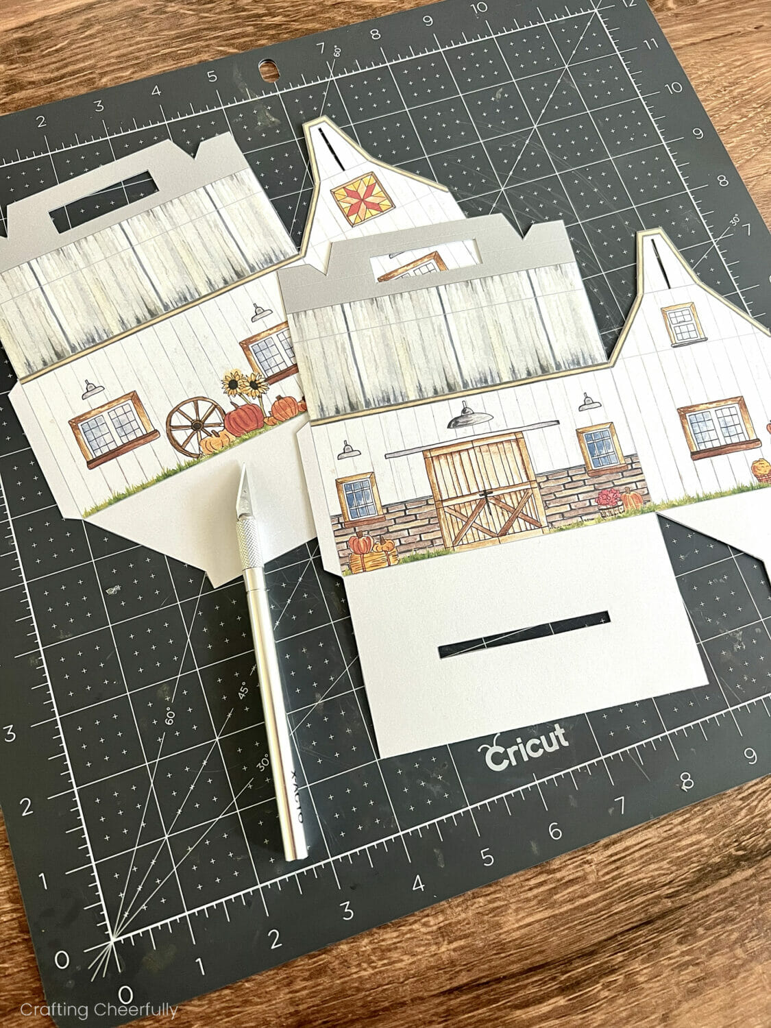A thin tab is cut from the bottom of the box with a craft knife.