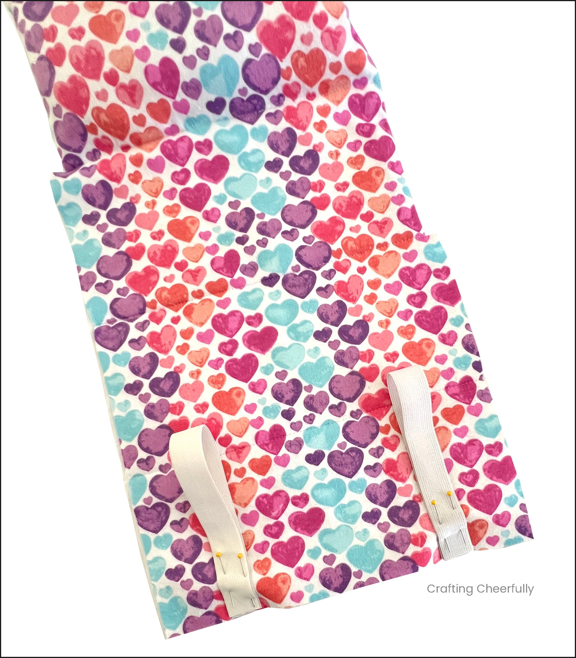 Two elastic loops are pinned to the bottom edge of the front sleeping bag.