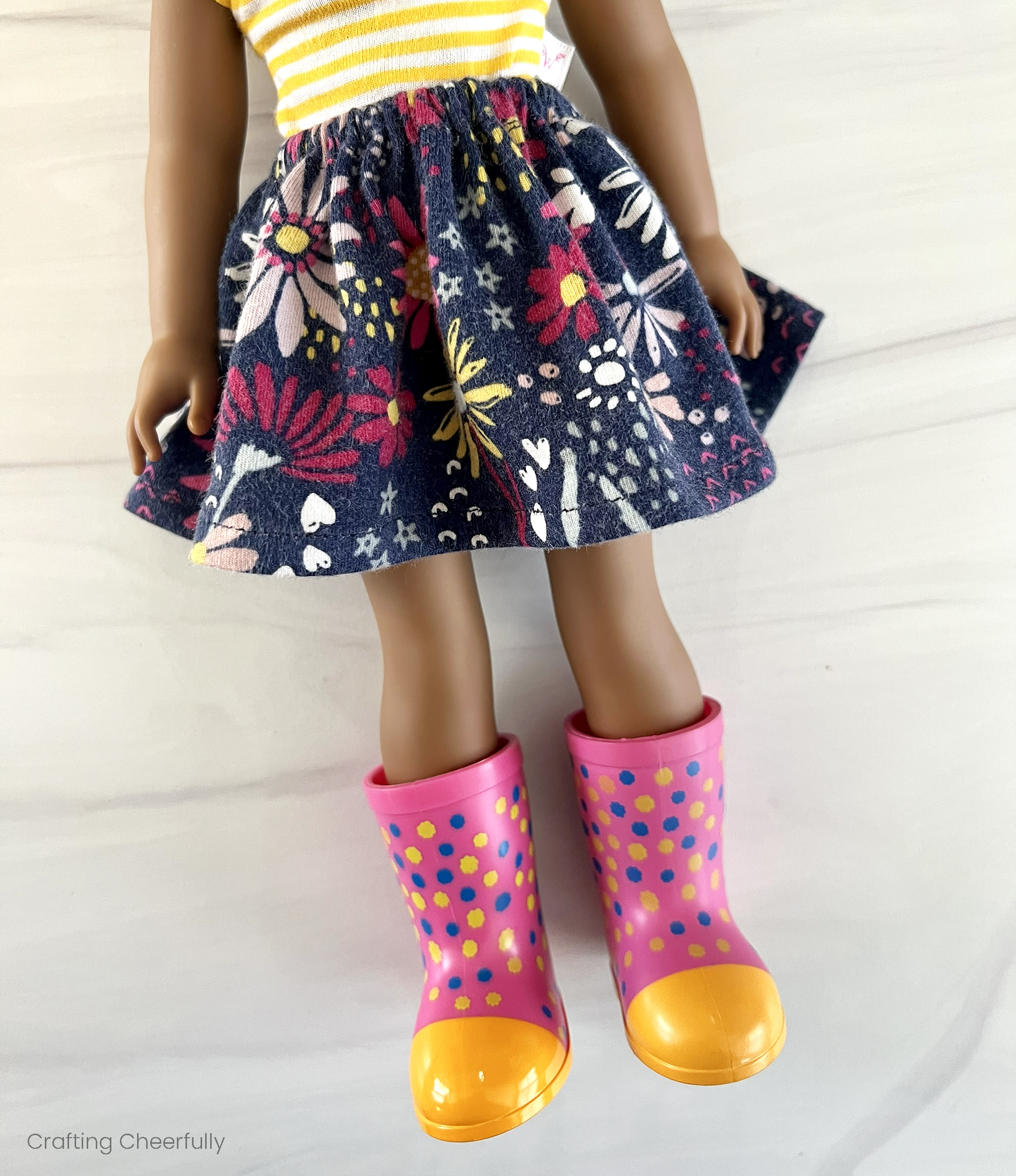 A doll wears the floral skirt.