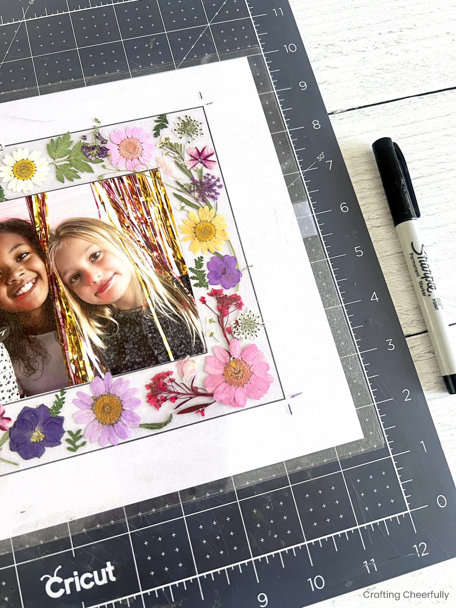 Sharpie is used to mark the corners of the floral frames.