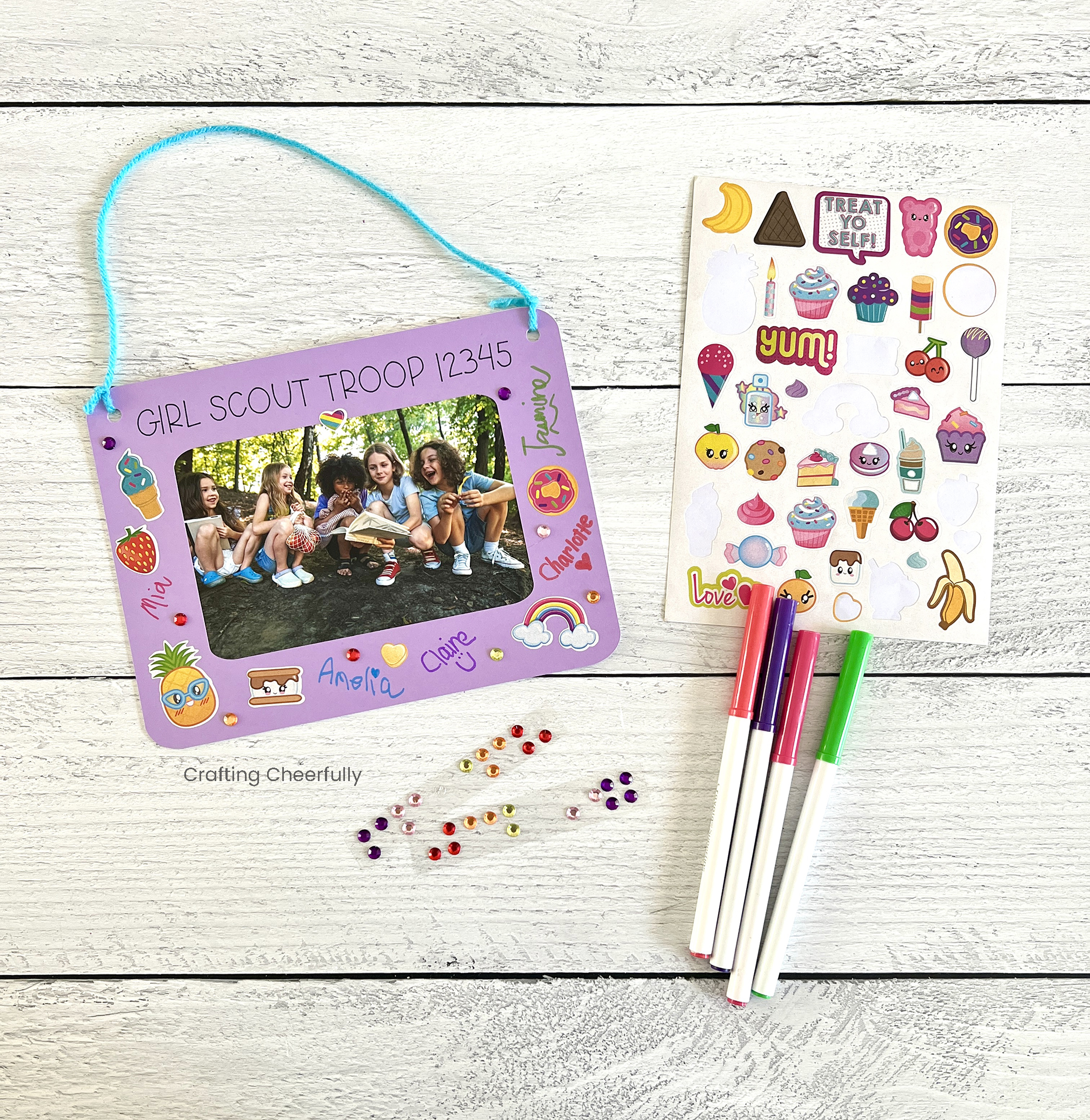 Stickers and markers are used to decorate the team frame.