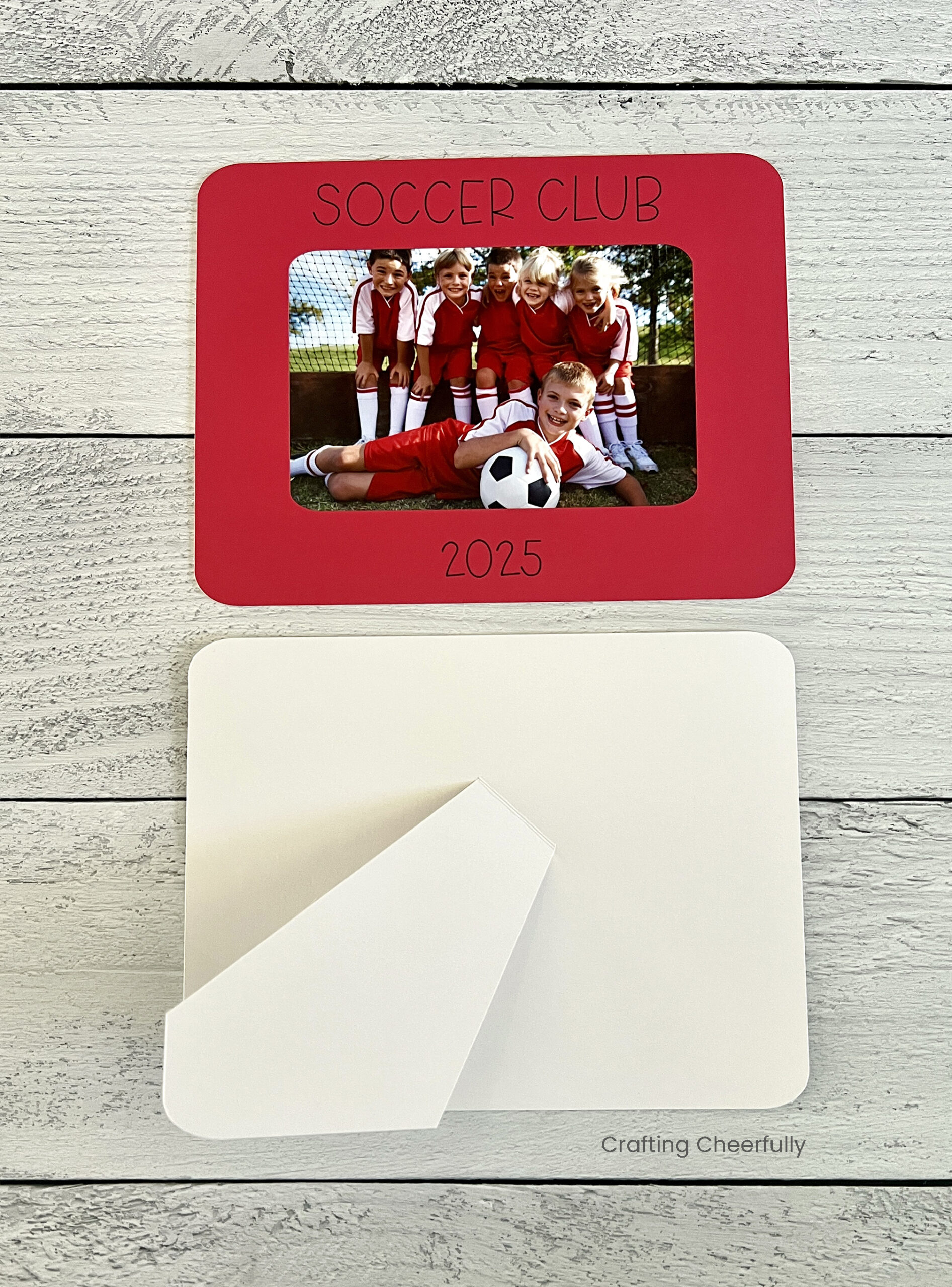 The cardstock with phot attached lays next to the chipboard kick stand.