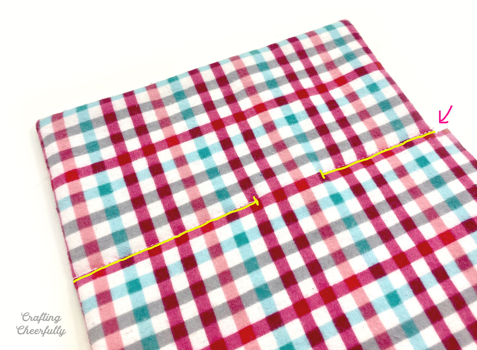 A horizontal line is stitched across the fabric layers 4" down from the top.