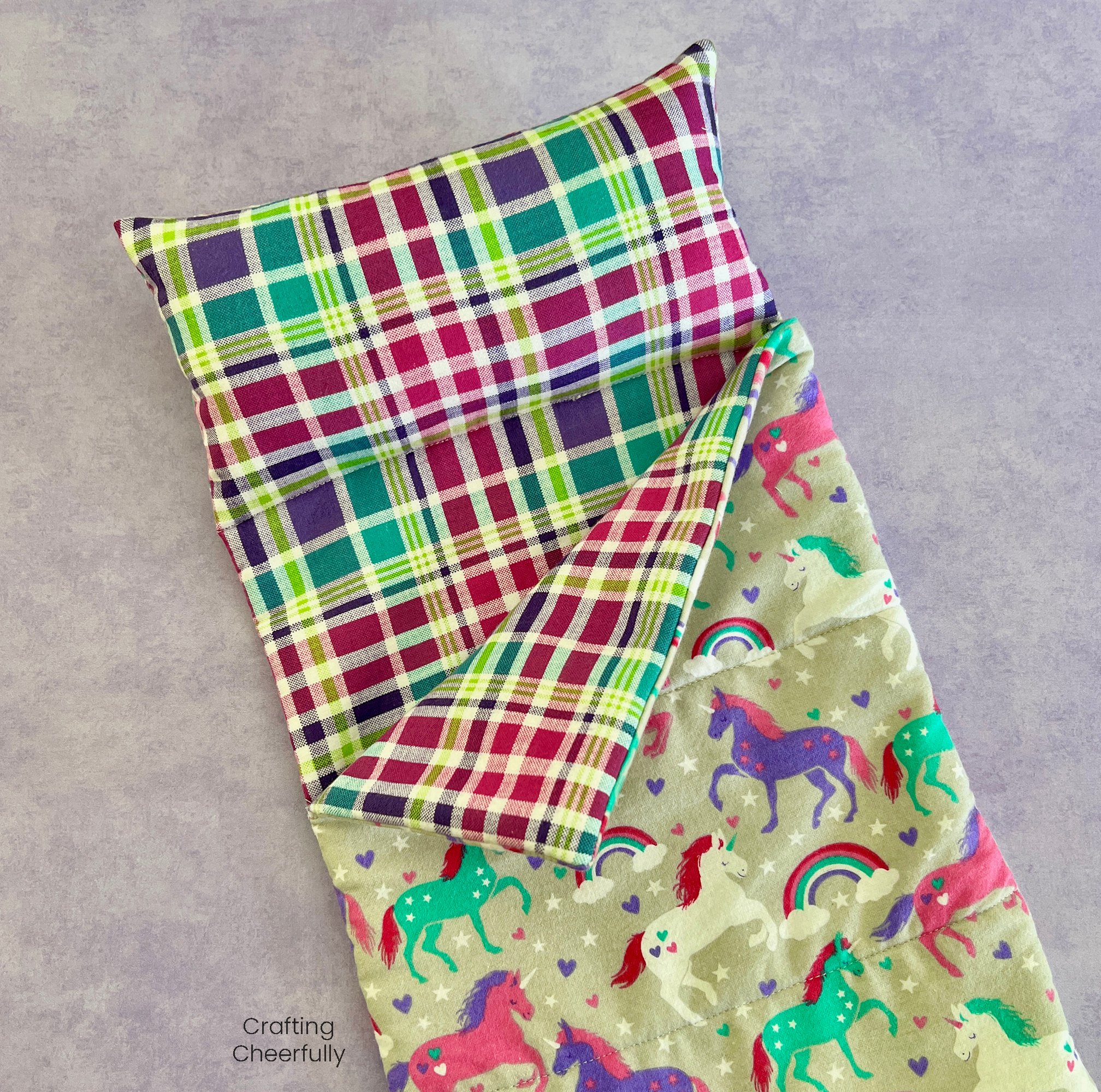Flannel sleeping bag for dolls made from cute unicorn fabric.