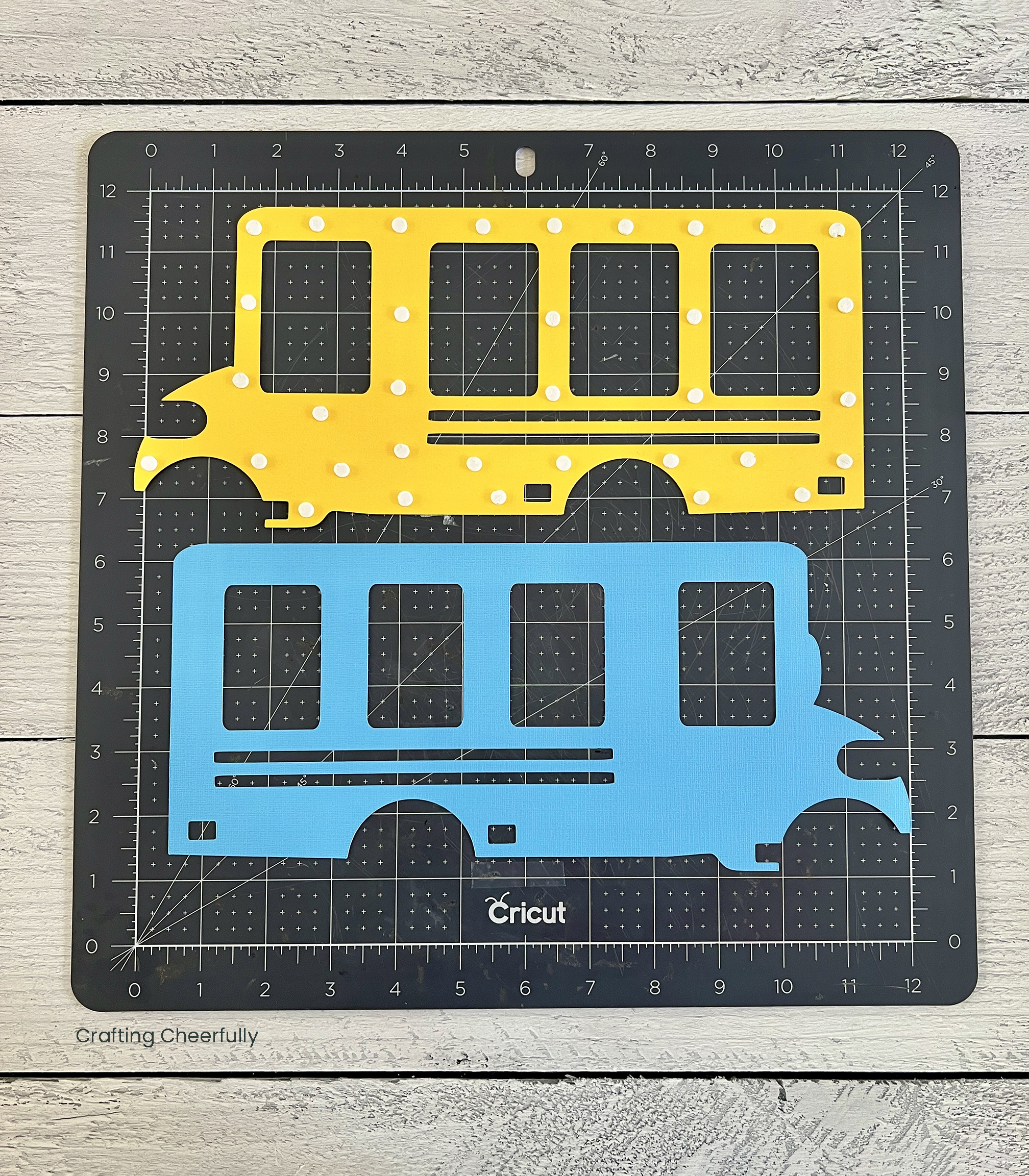 Back of the yellow bus layer is covered in foam dots, lays next to the blue layer.