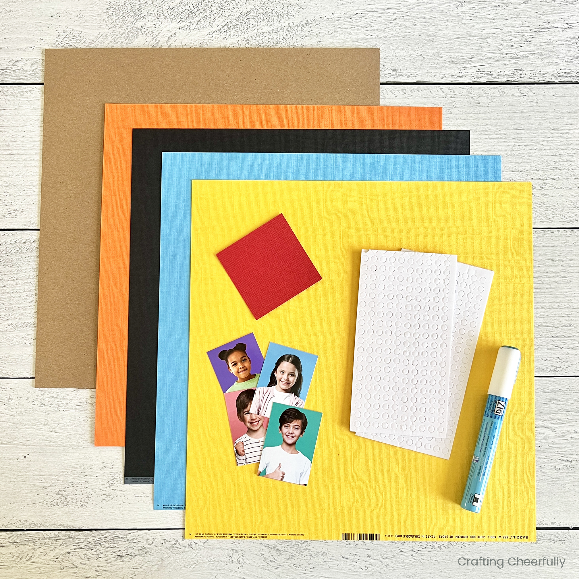 Supplies needed including colored cardstock, foam adhesive dots, glue stick and photos.