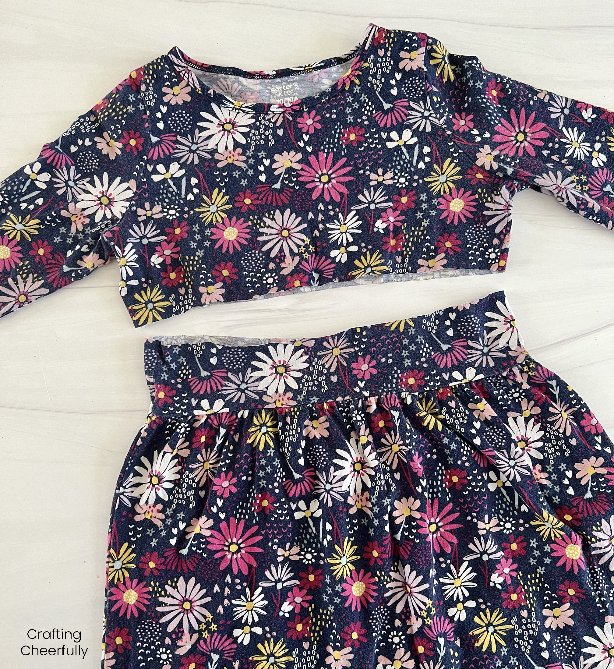 A girl's floral dress is cut in half above the waist band.